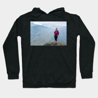 Woman backpacker hiking on a trail Hoodie